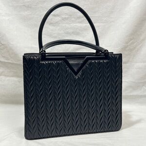 Crossi New York Black Handbag 
Black Leather Quilted Satchel